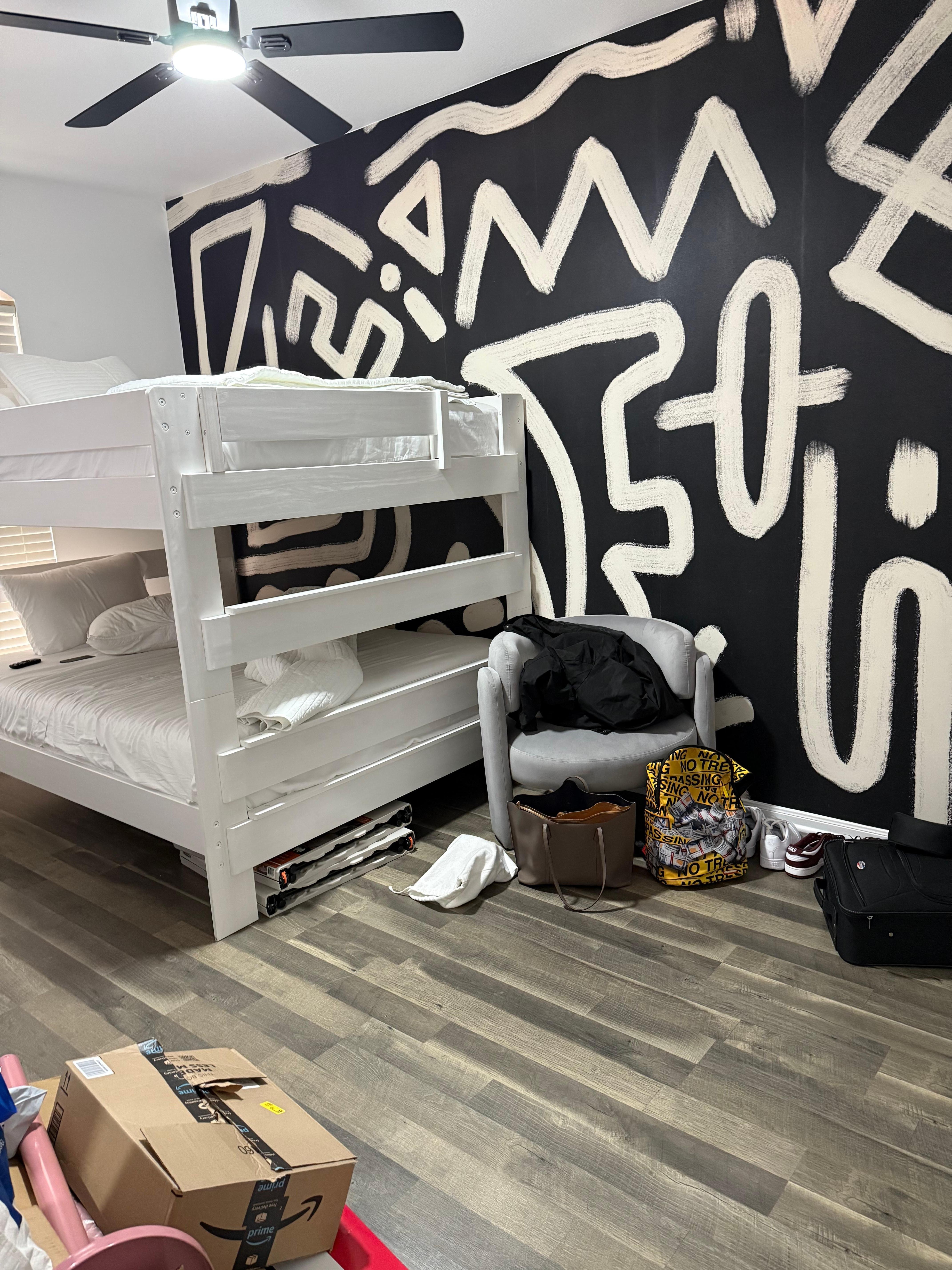 Downstairs double bed wallpaper is so cool. This room does have a TV.