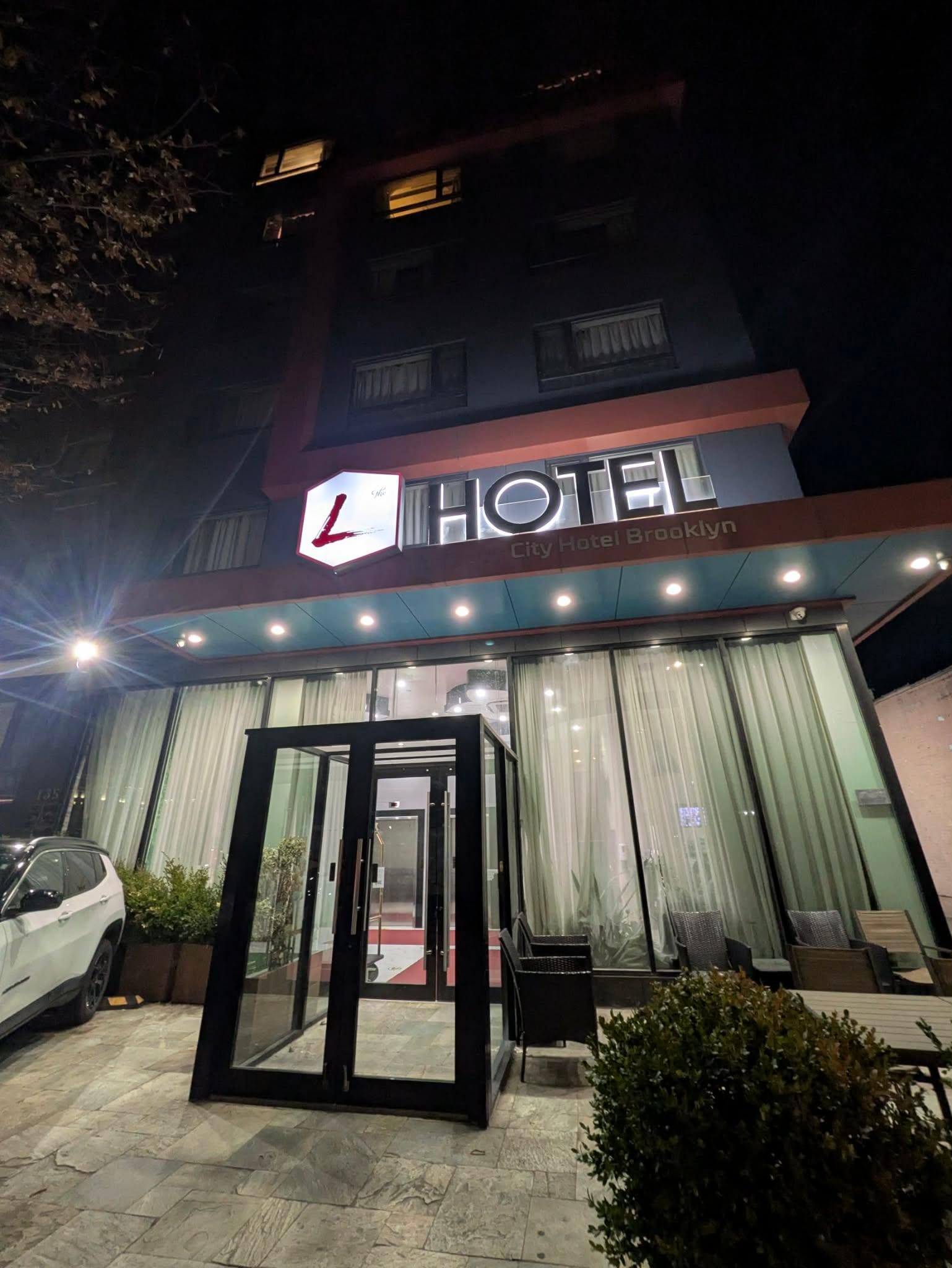 Front of the building. It is between a couple buildings in the area. 