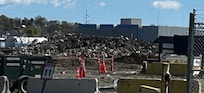 Rubble right next to building that crews worked on with jackhammers.