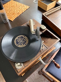 The unit has a very old wind up record player that is quite a novel attraction.