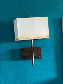 Wall lamp between beds