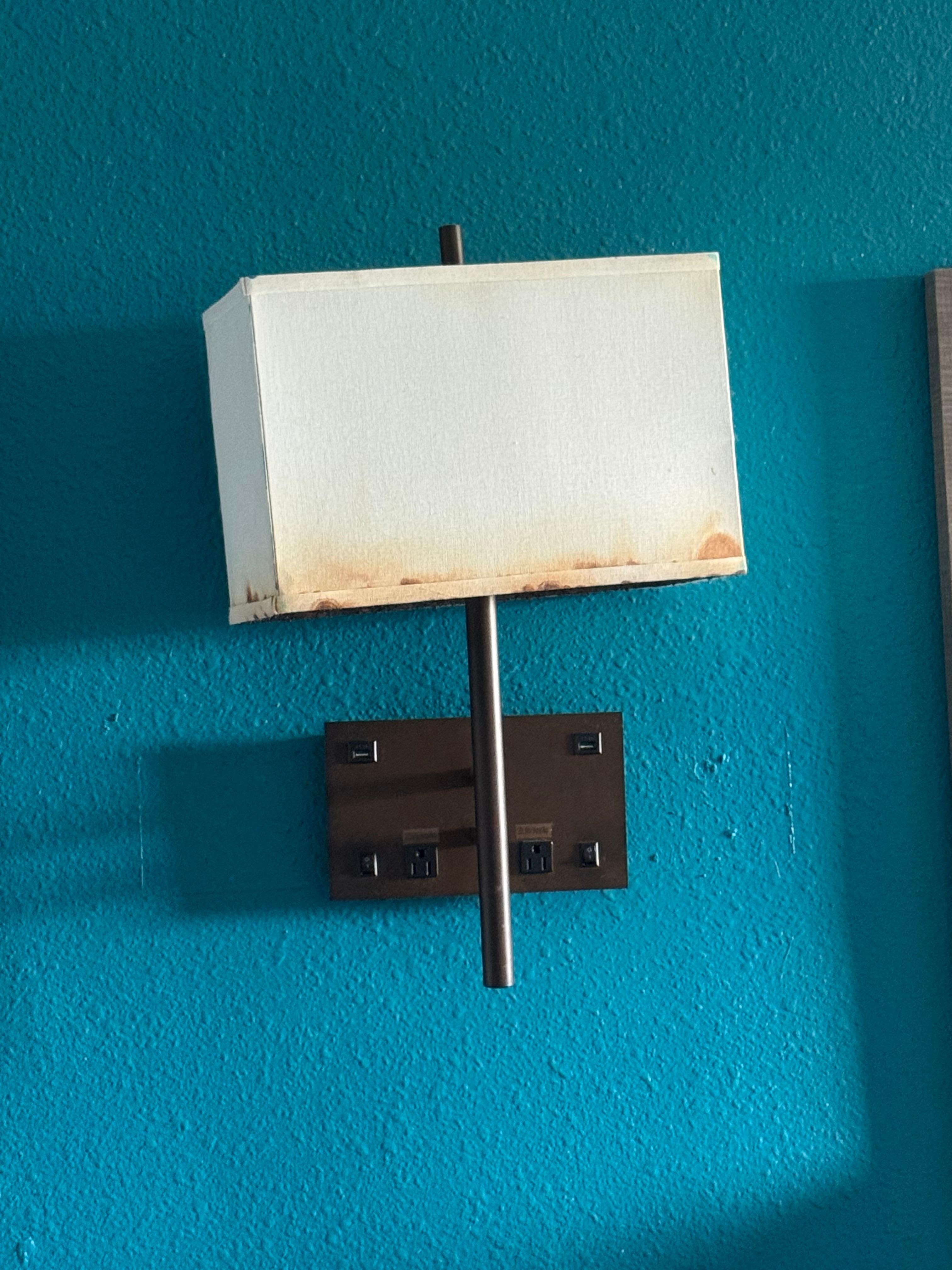 Wall lamp between beds