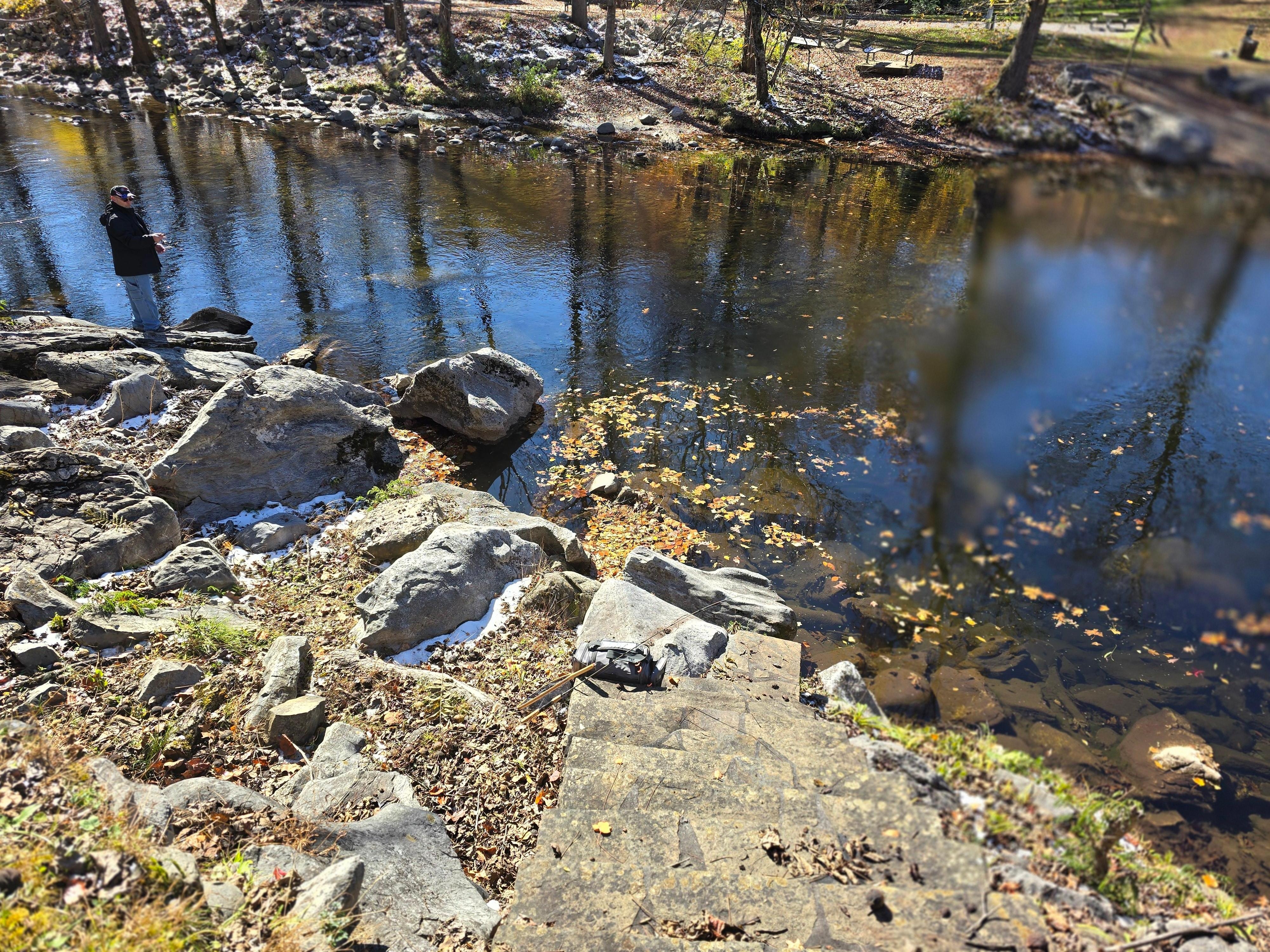 Very steep down to the river; only 3 jagged rocks to fish from; too deep to get in the water.