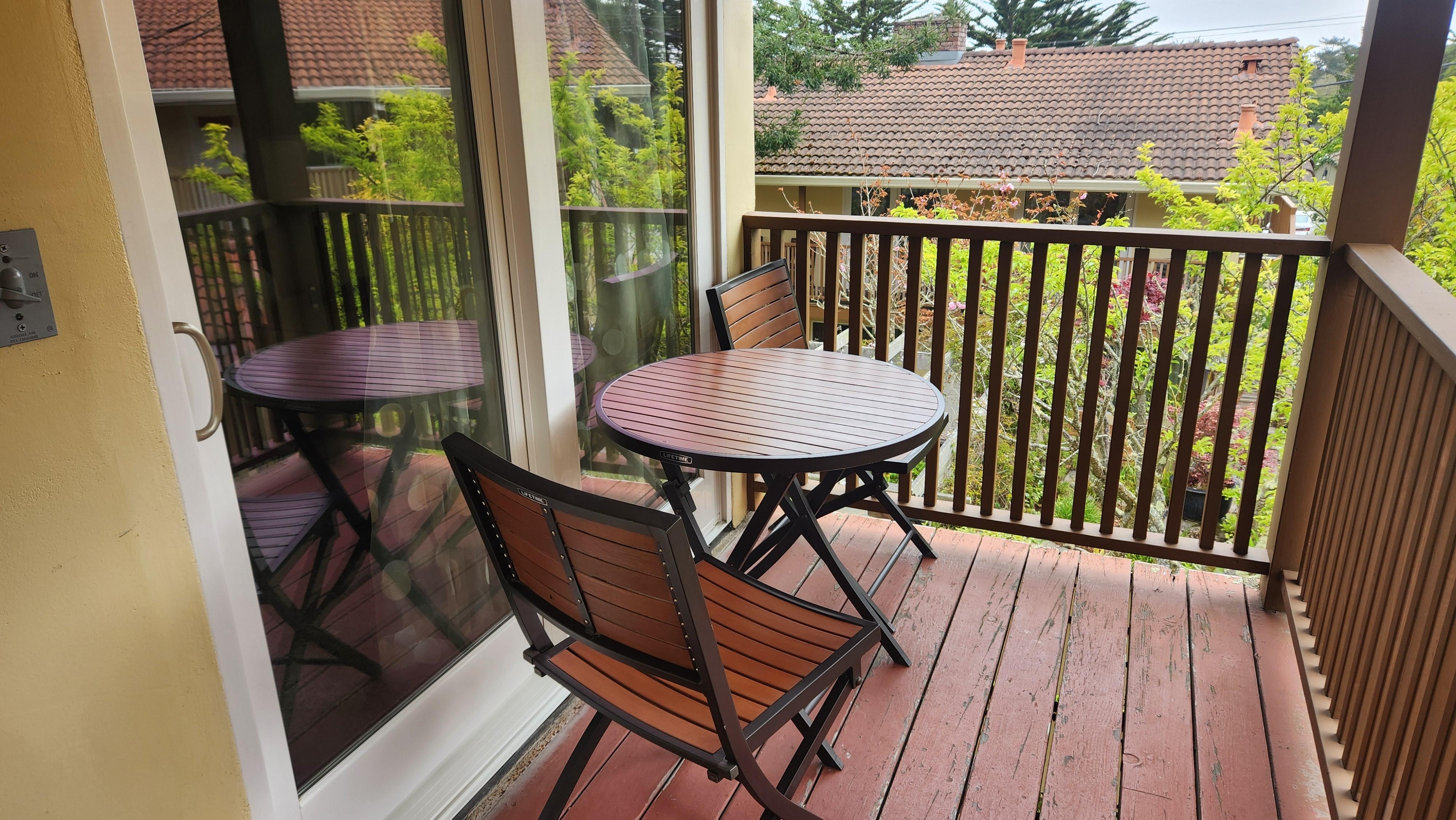 Balcony with a table and 2 chairs