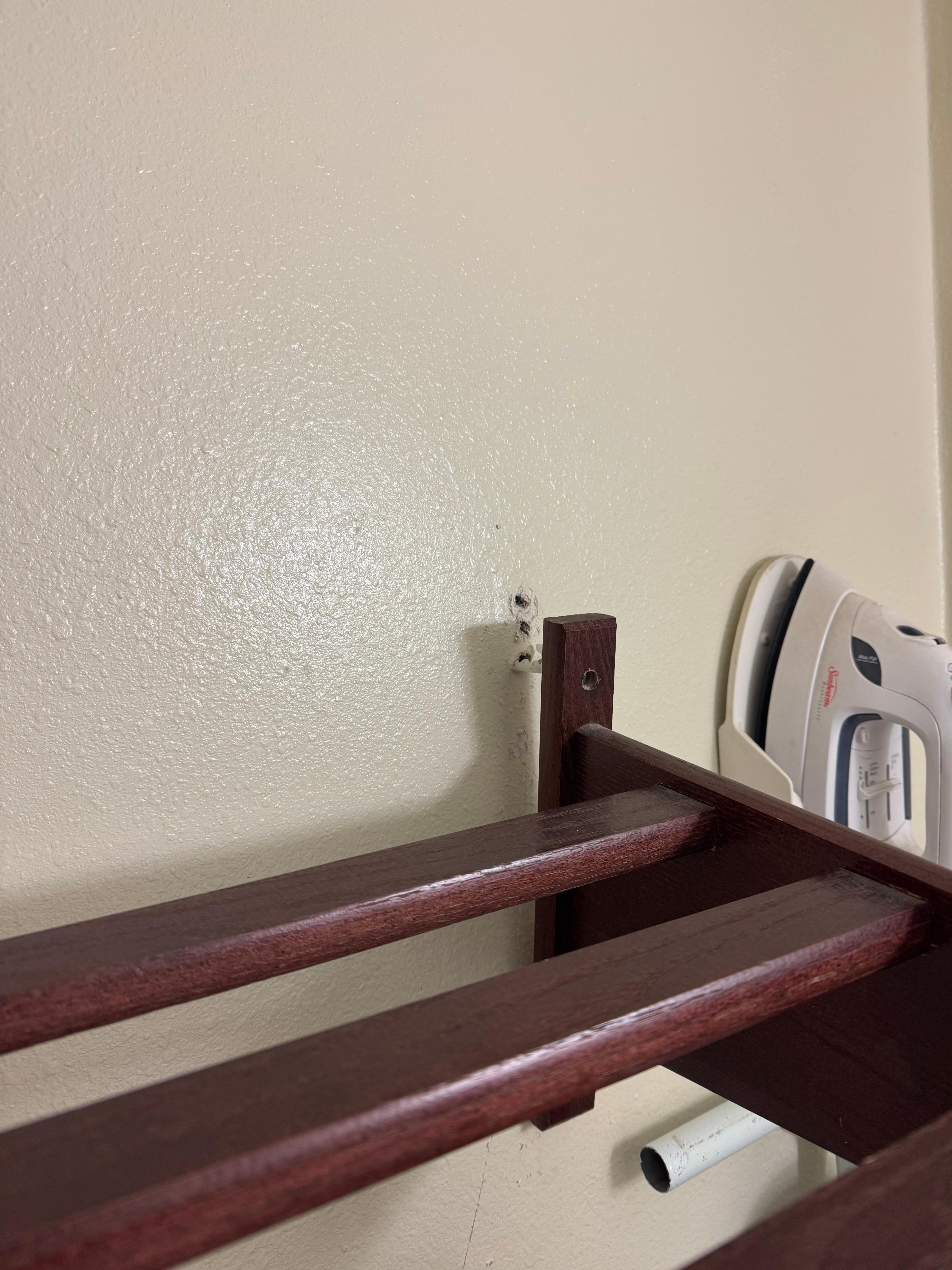 Coat rack coming out of the wall