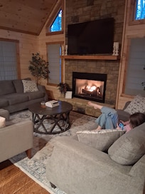 Our daughter enjoying the fireplace