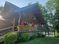 Our large group on the side of the wrap around deck / porch (photo taken by host Richard)