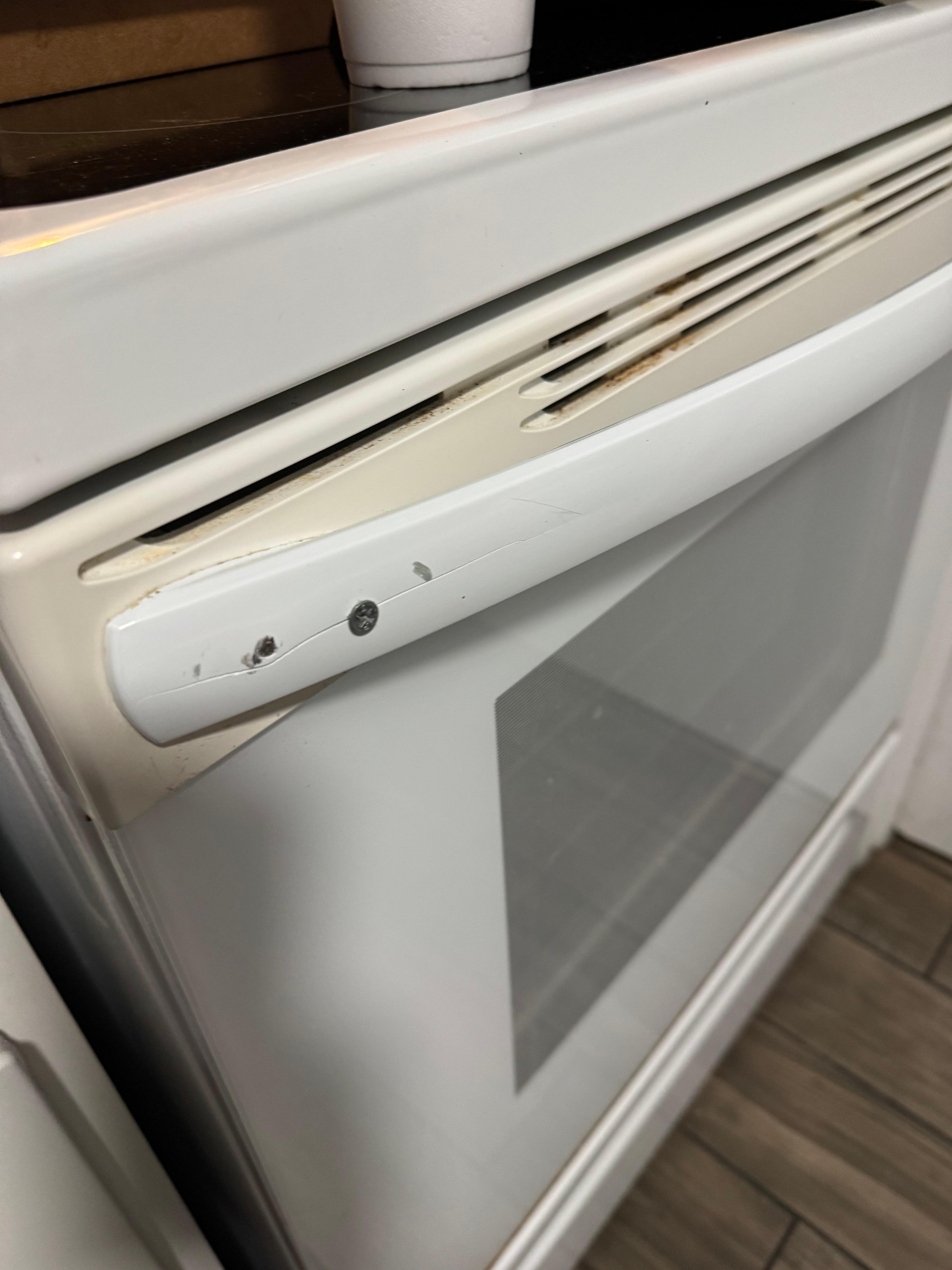 Stove was dirty and held together by exposed wood screws.