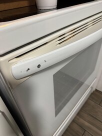 Stove was dirty and held together by exposed wood screws.