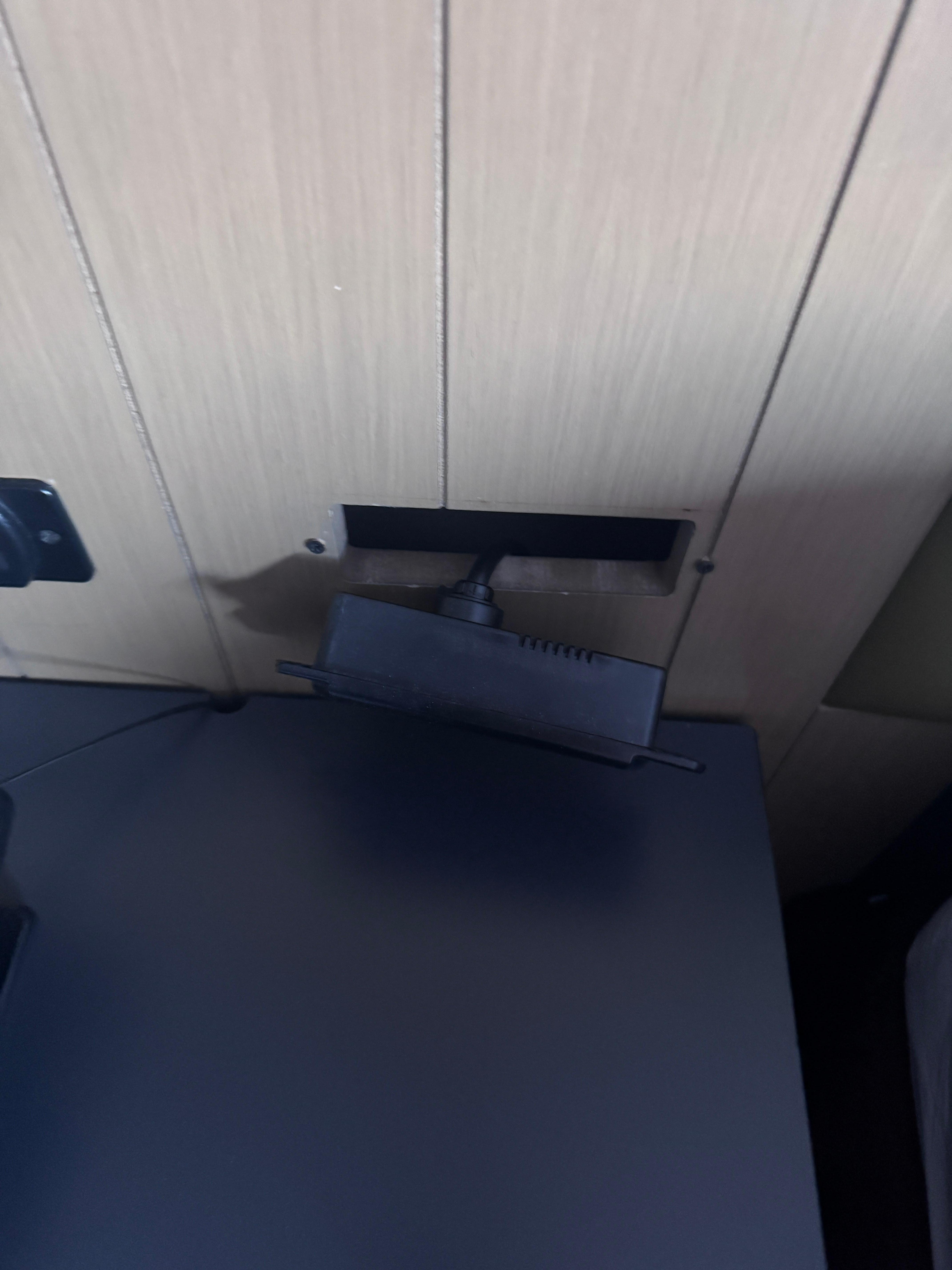 Electrical fixture next to the bed. 