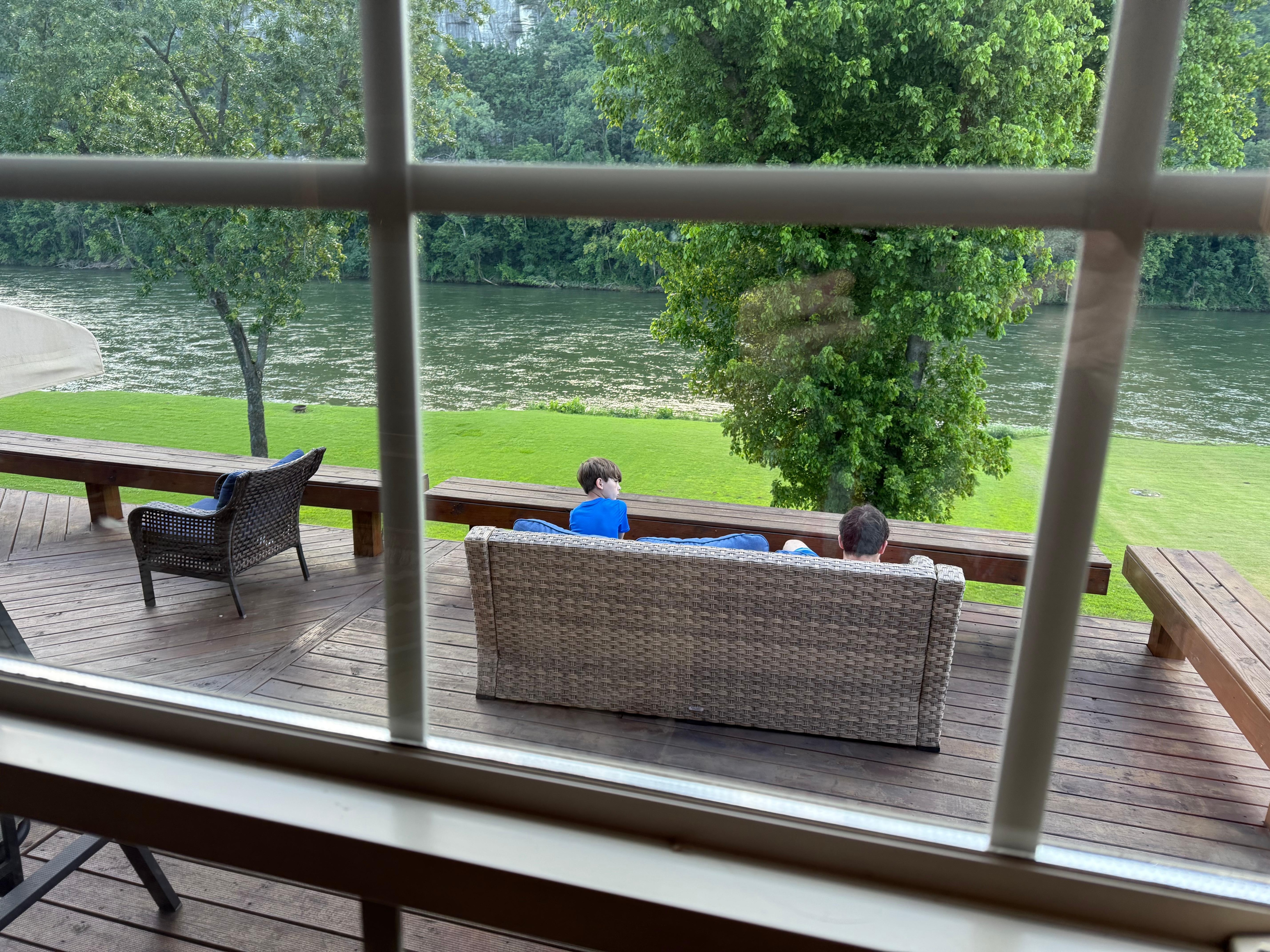 Our boys enjoying the river sitting in the deck. 