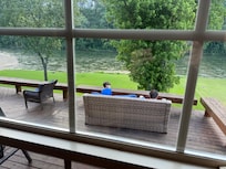 Our boys enjoying the river sitting in the deck.