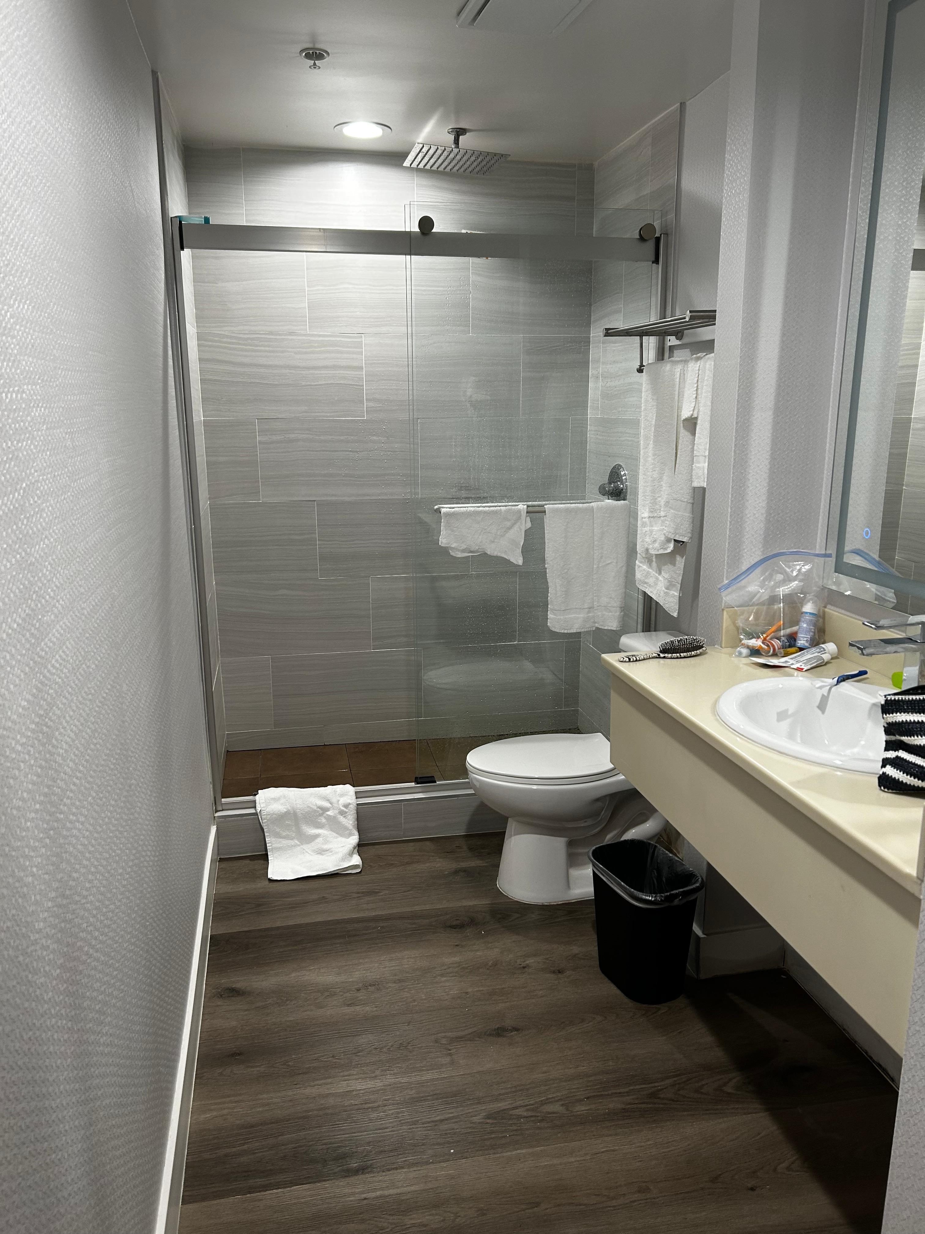 New floor and shower with lighted mirror. Turn water to cold for hot water. Waterfall shower 