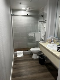 New floor and shower with lighted mirror. Turn water to cold for hot water. Waterfall shower