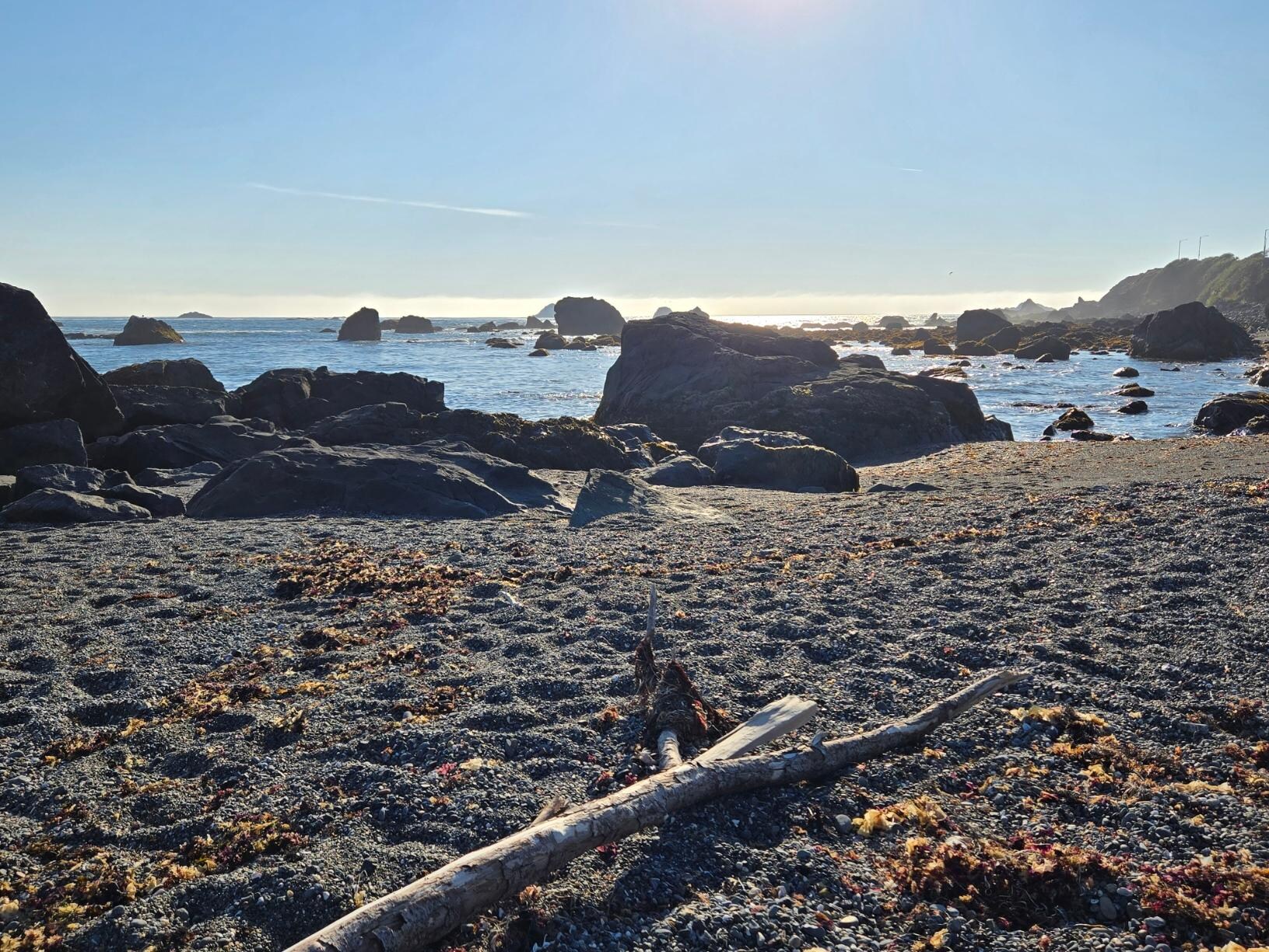 On the beach near the house.
