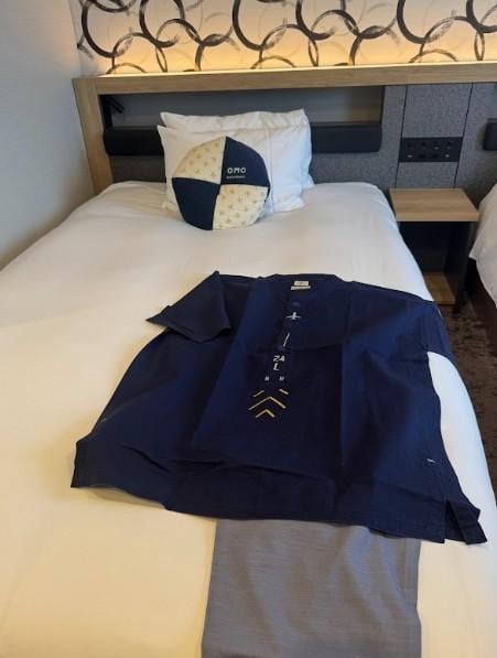 Comfortable bed and pajamas provided.