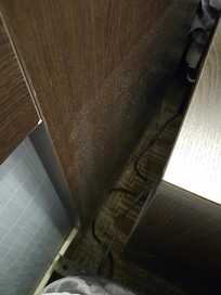dust behind the side table