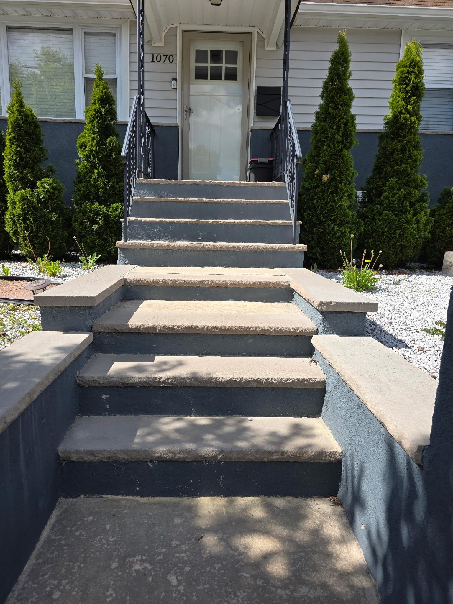 View of stairs outside showing lack of rails and safety concerns