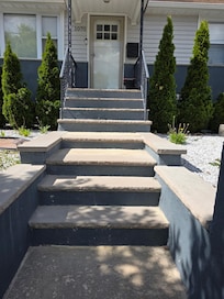 View of stairs outside showing lack of rails and safety concerns