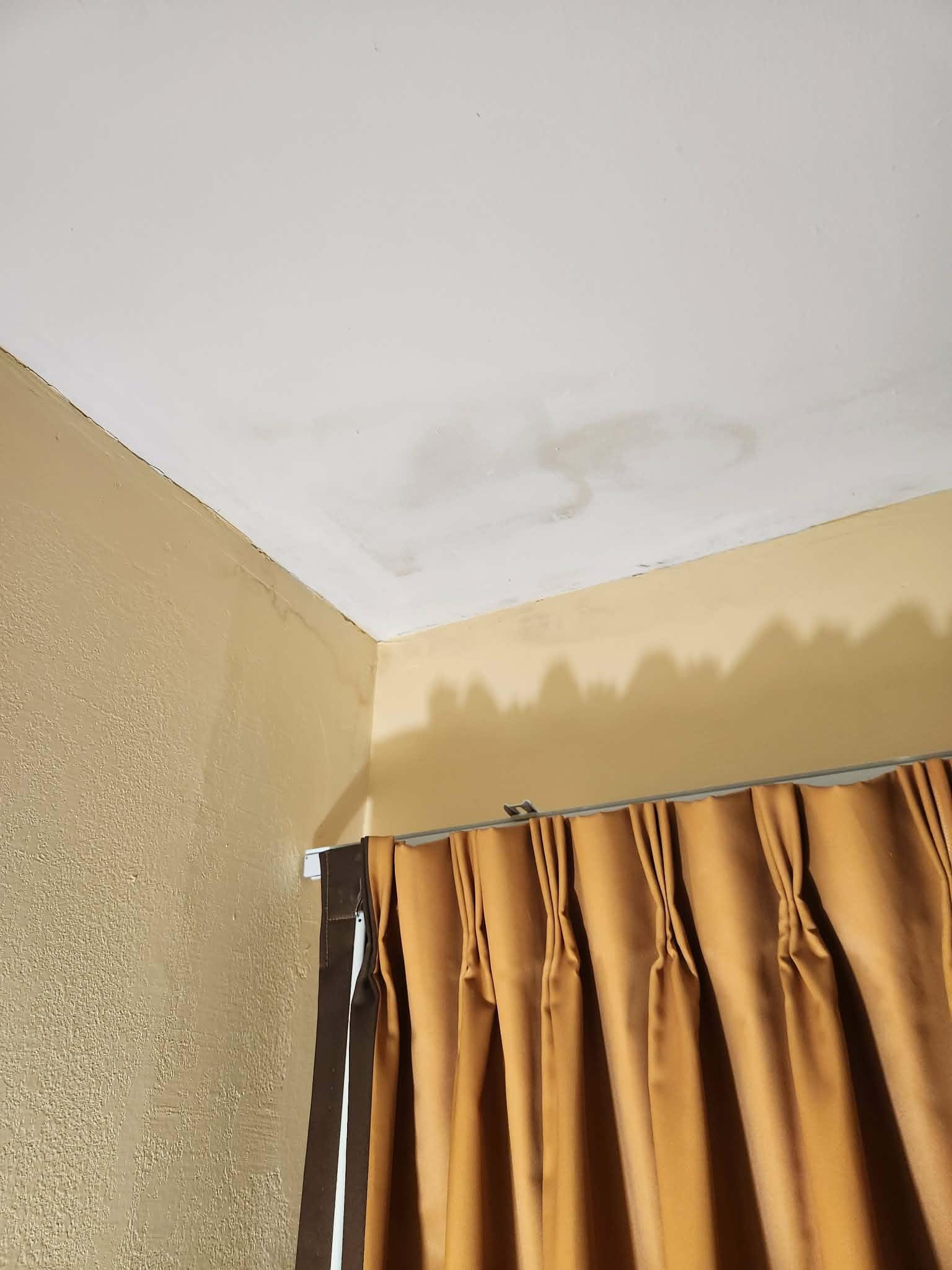 More water damage on ceiling in our room.