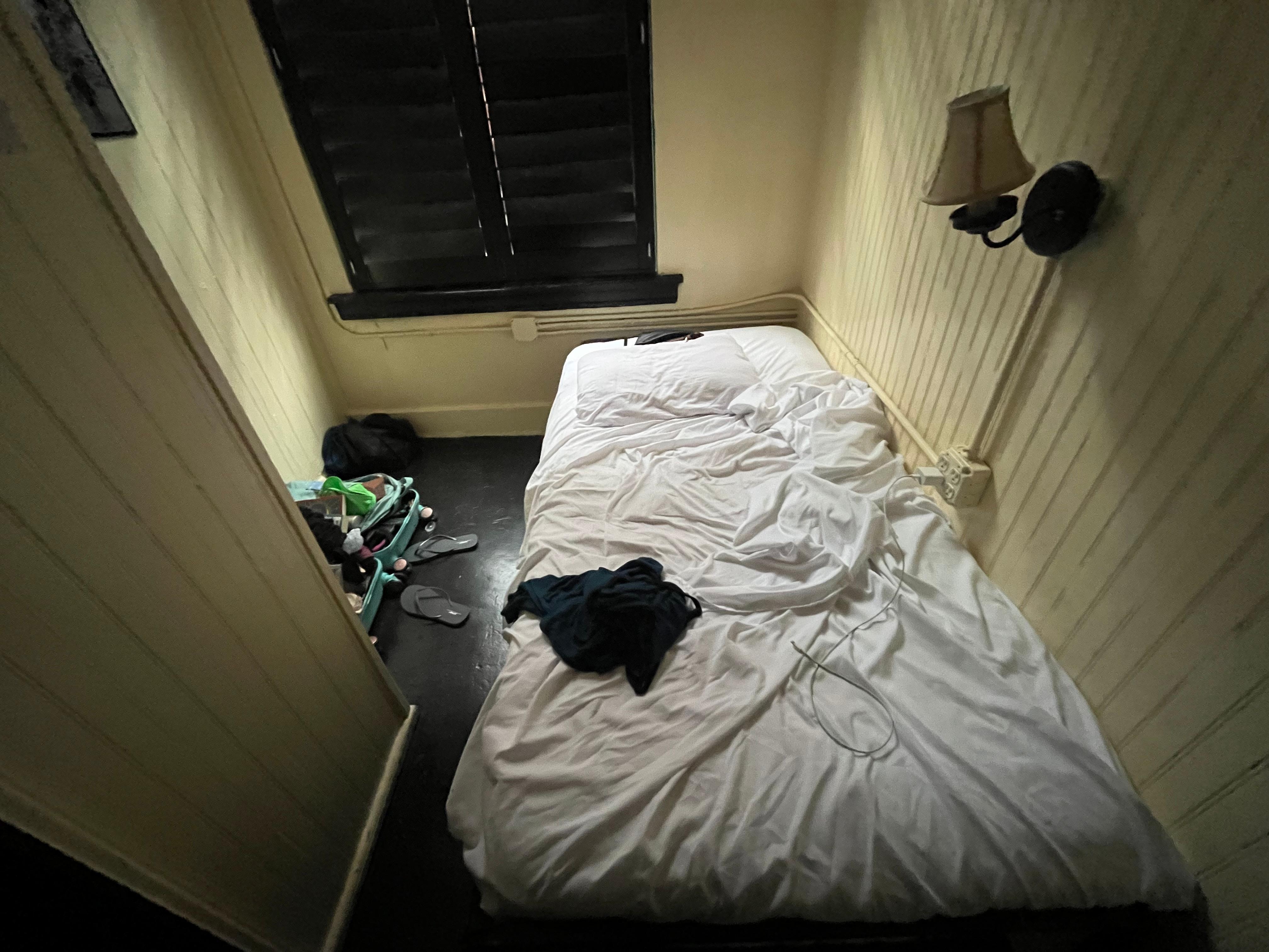The inside of my cabin. The bed was actually pretty comfortable. But the only linens I got were sheets. So maybe might want to see about a blanket. 