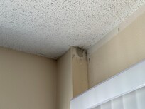 water damage over the slider in the living room.