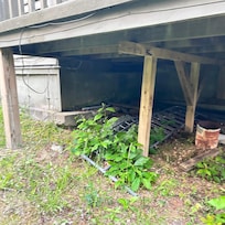 Discarded headboard and lattice not removed from property