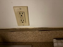 At the sink, veneer coming off