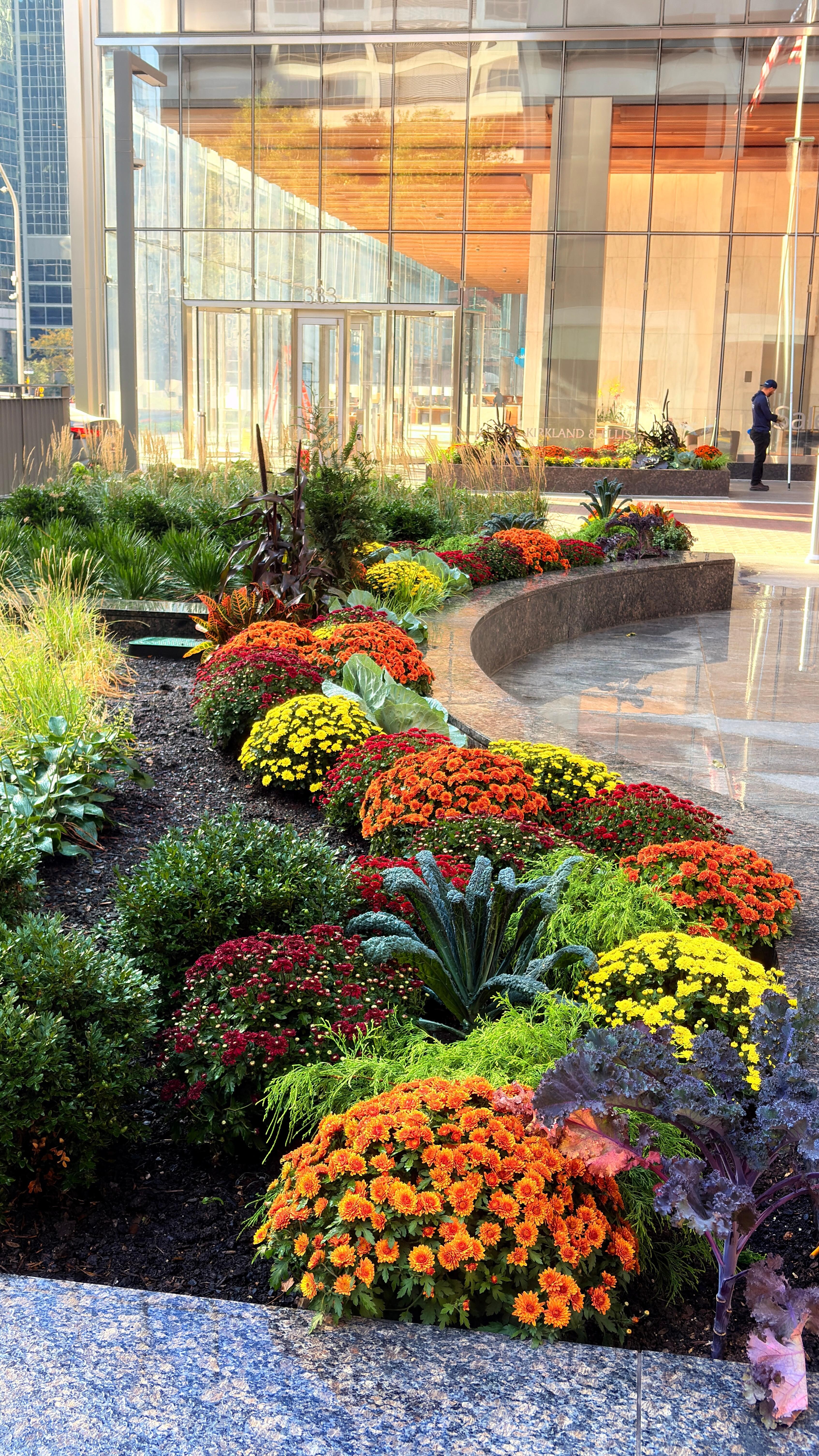 Colorful landscaping nearby.