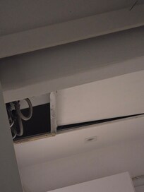 So small, the water heater is in the ceiling and the tiles open.