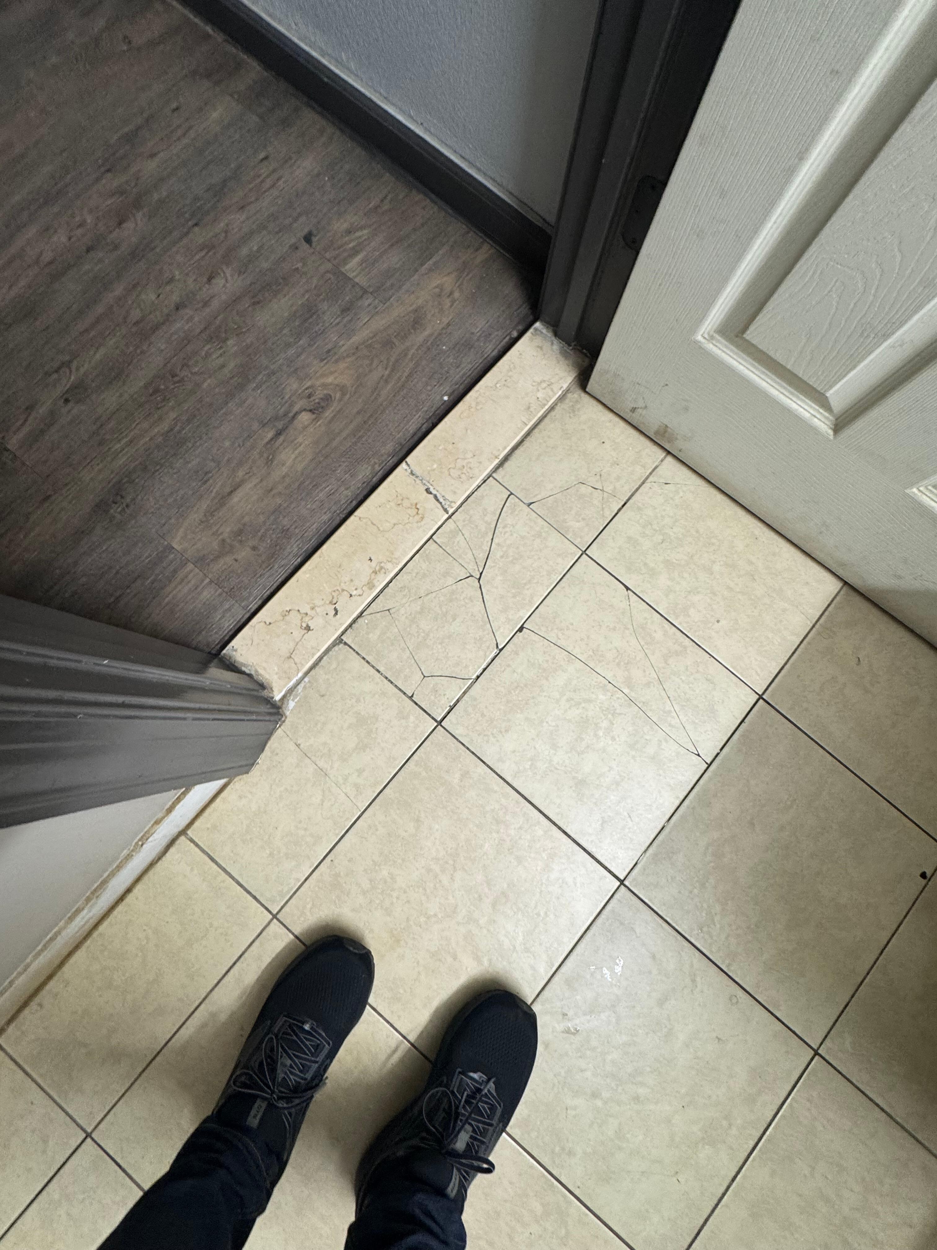 Broken tiles on bathroom floor