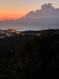 After sundown, Agropoli with the many lights and Amalfi, Positano with the lights in distance.