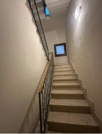 Two flights of stairs to room on second floor