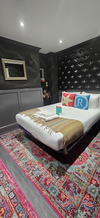 Bedroom, Queen size bed. An electric fan was provided for hot weather.