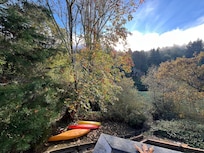 View from deck showing trail to river