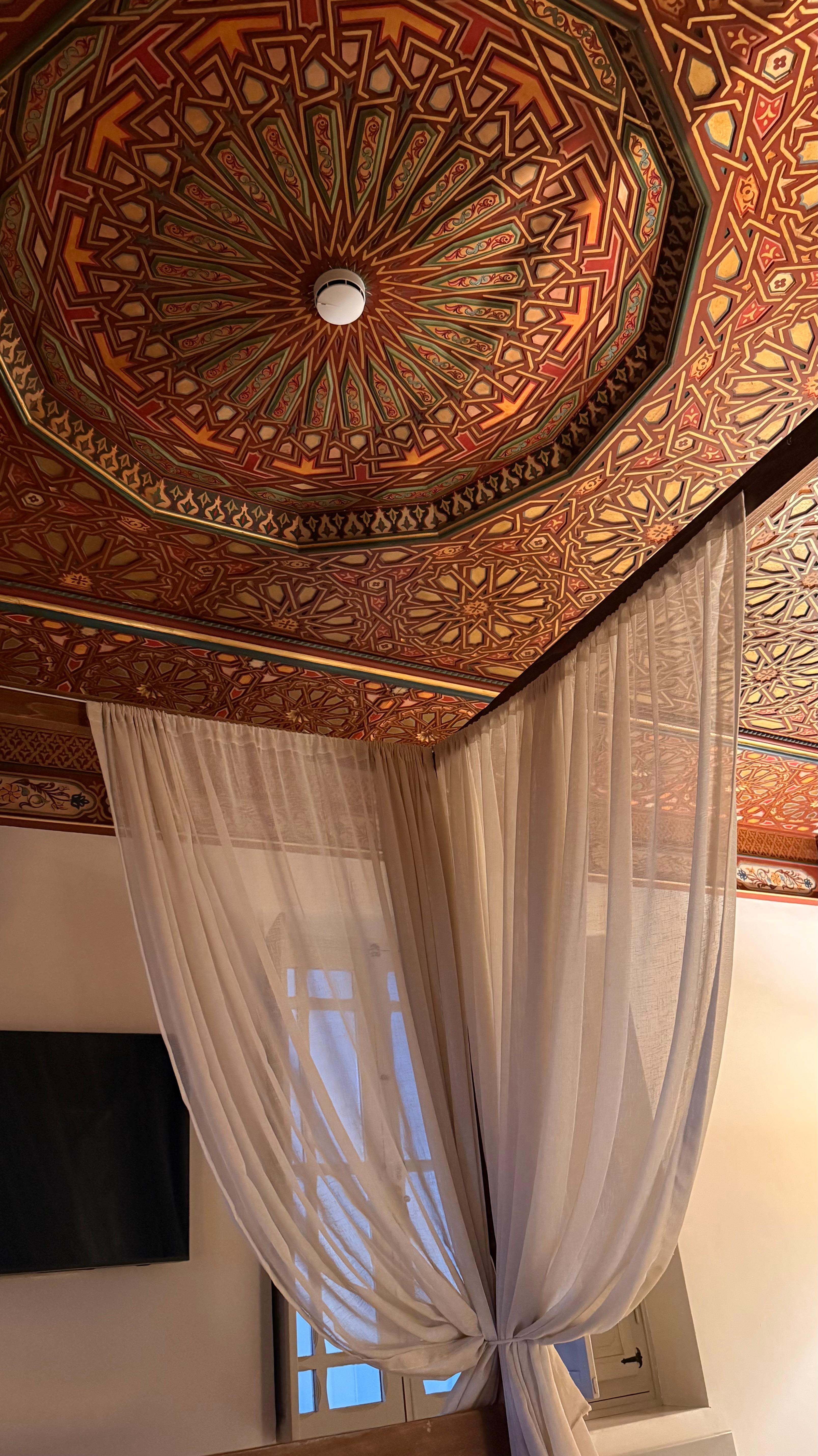 (ceiling detail with canopy)
Art above you, in every sense. The hand-crafted ceiling is a masterpiece—every detail telling a story, every pattern reflecting centuries of artistry.