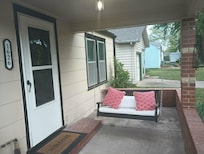 nice front porch swing, just can't swing on it when raining because it is attached to the edge of the porch.
