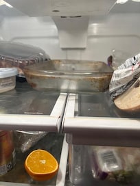 Dish placed in refrigerator to catch the leaking water