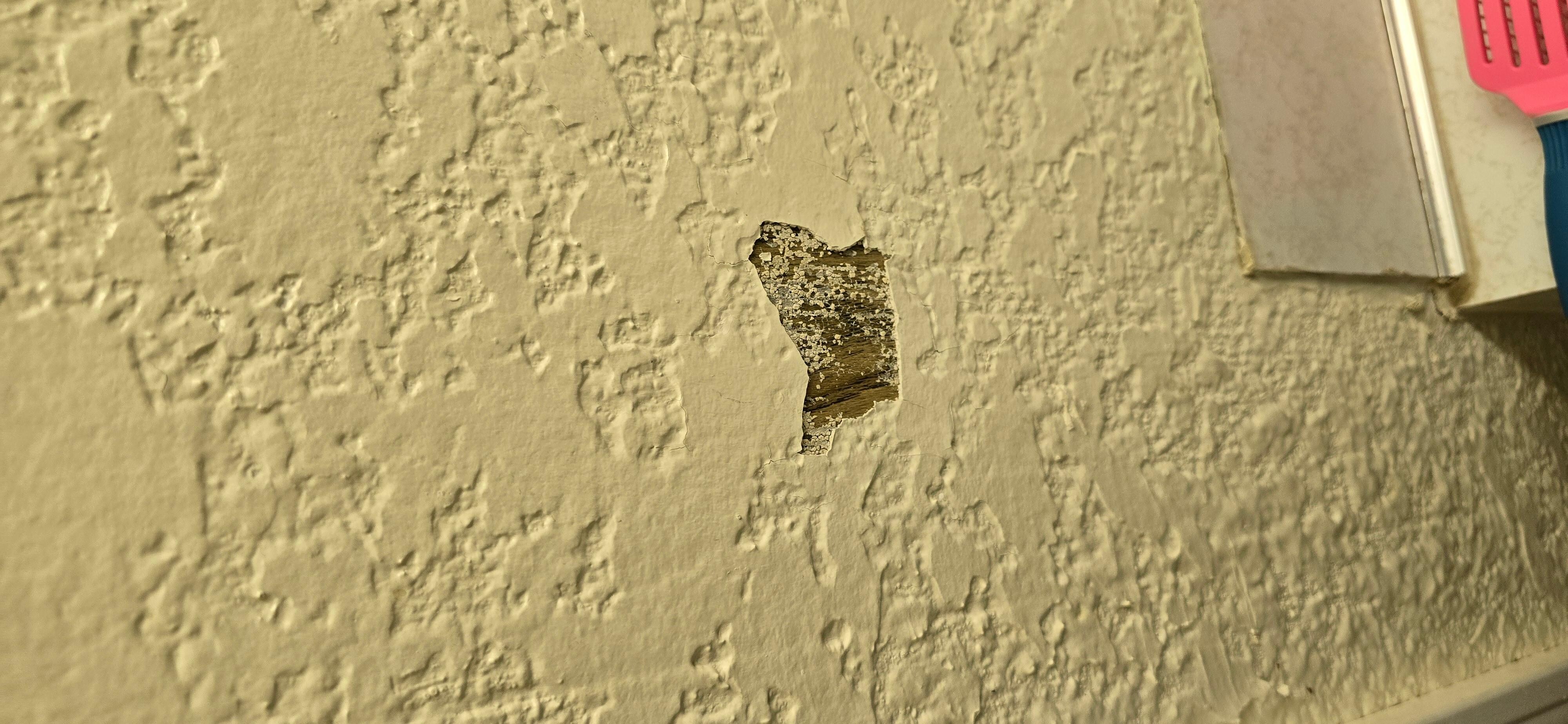 They plastered over wood paneling which obviously doesnt stick well. 