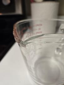 Broken measuring cup from kitchen cabinet