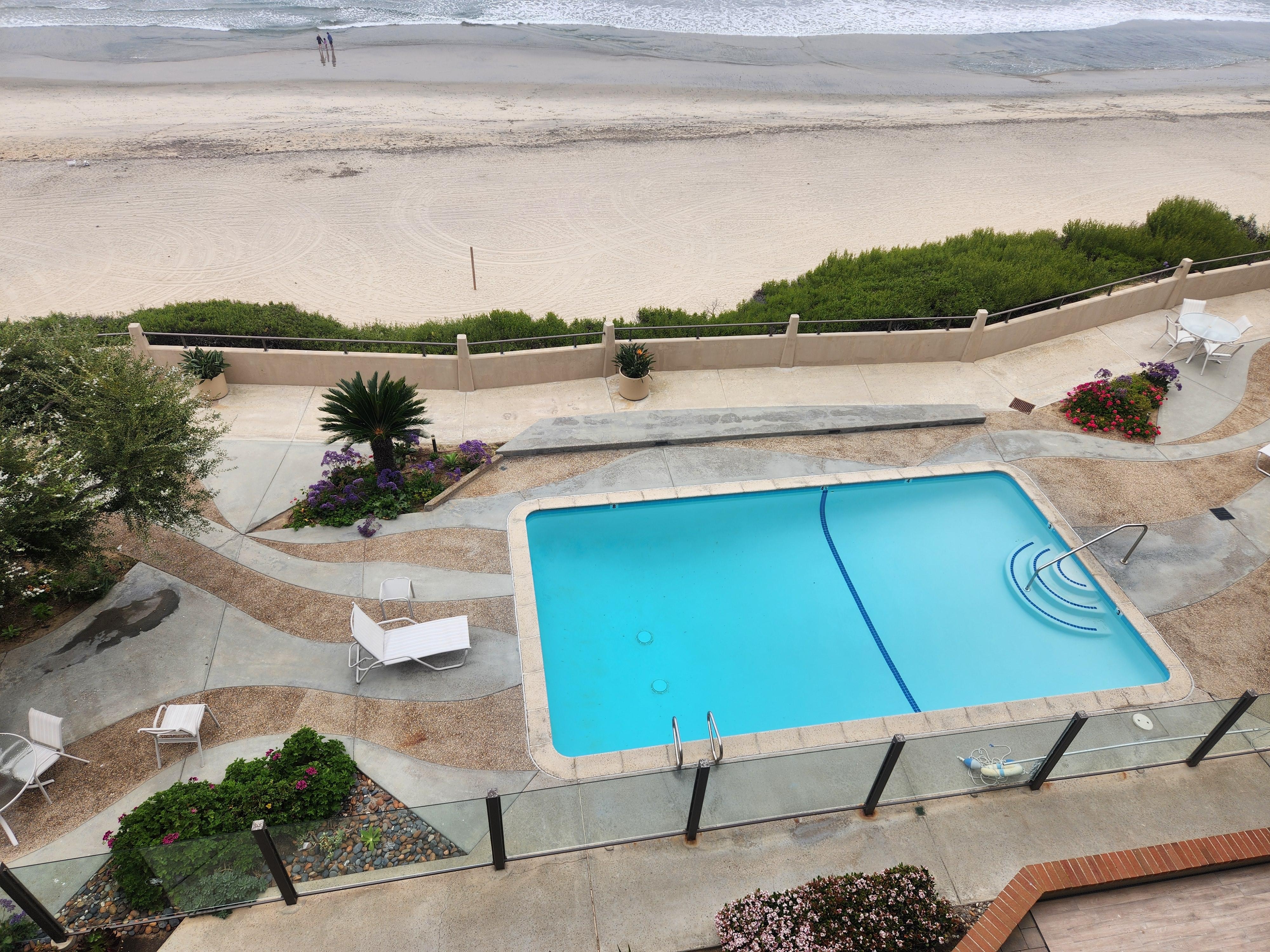 One of several pools on the property, thus one is directly below the balcony. 
