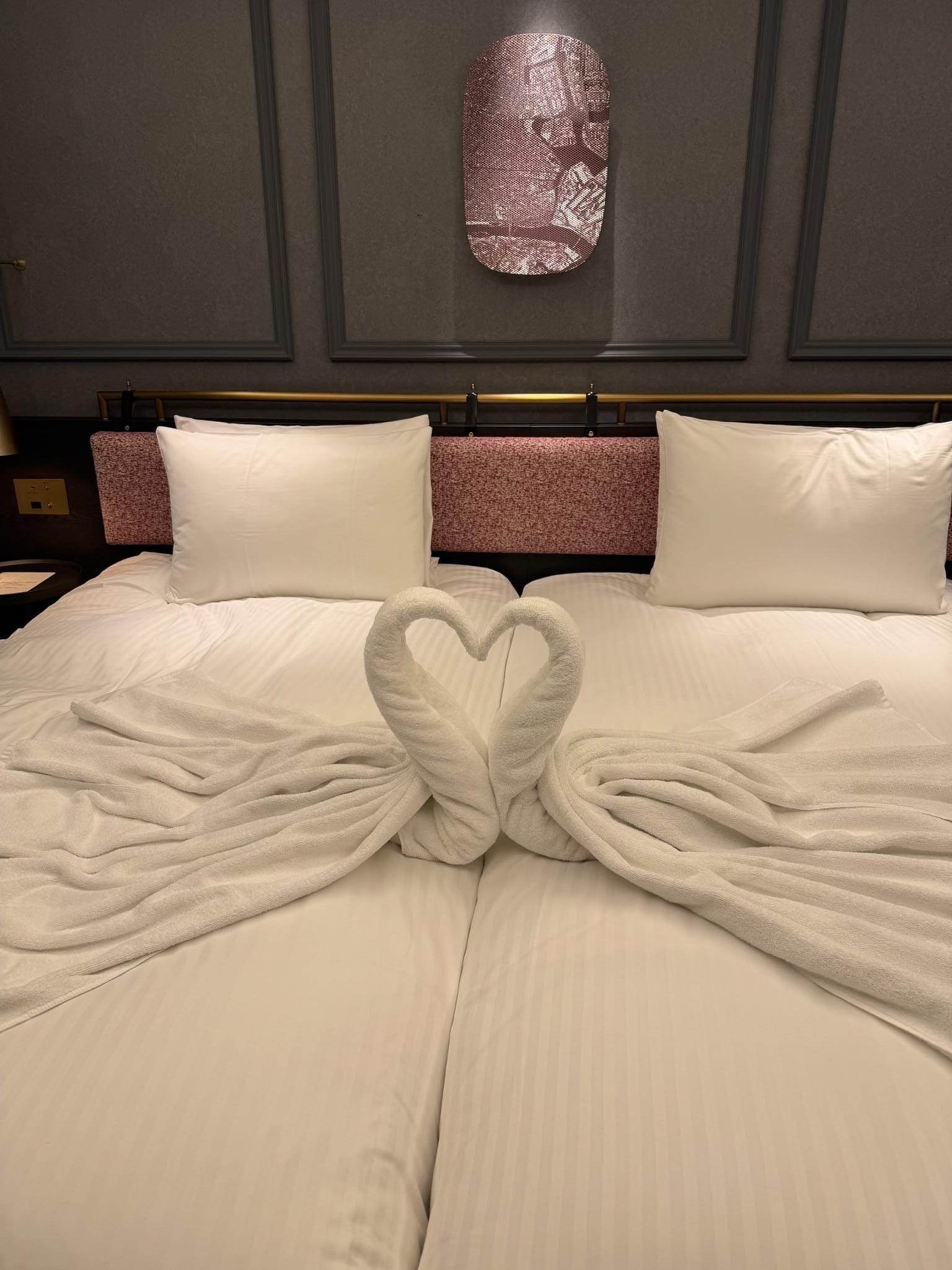 A swan couple- very thoughtful.