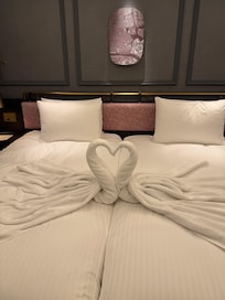 A swan couple- very thoughtful.