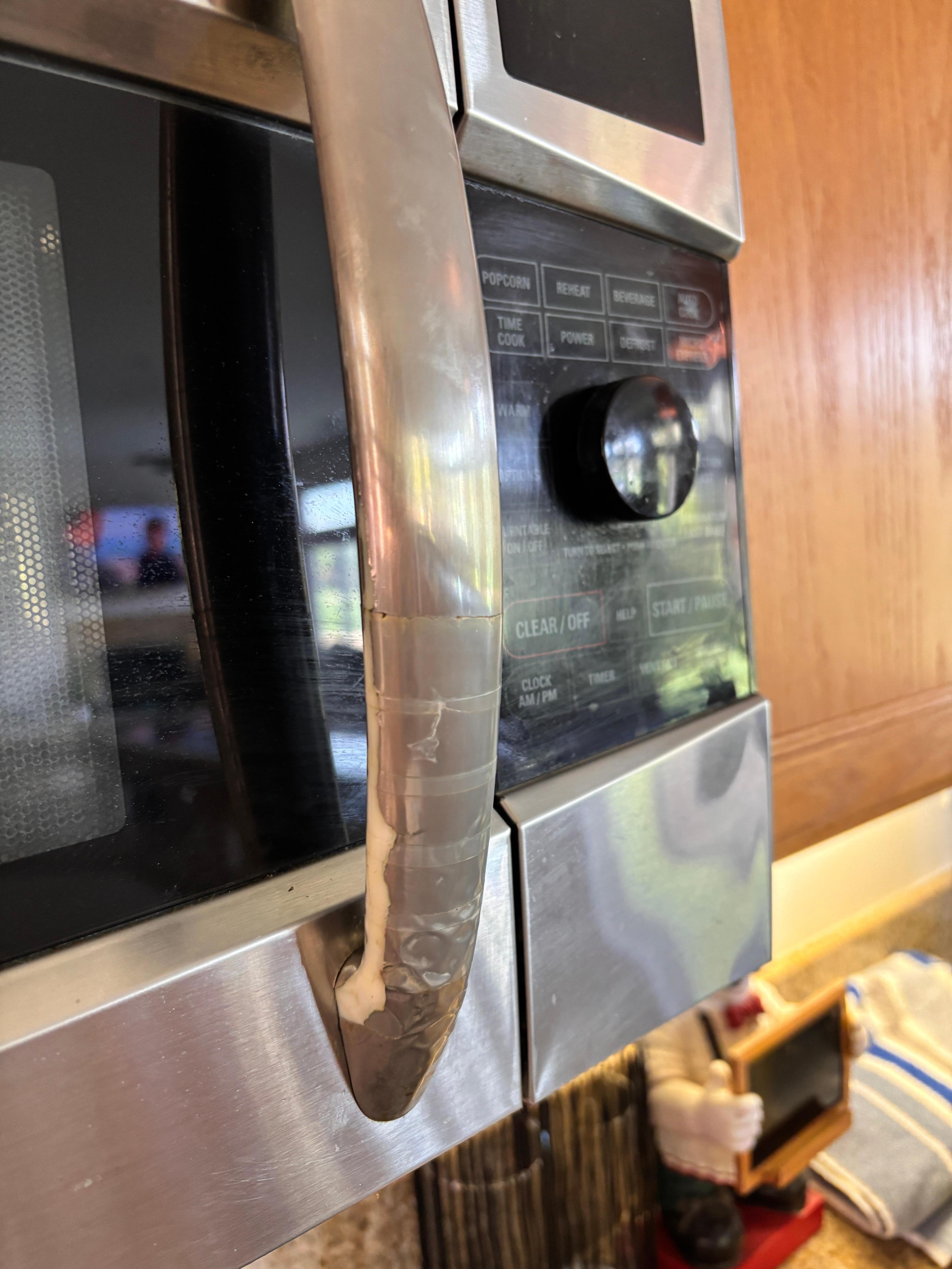 Tape on microwave door handle 