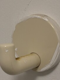 Dirty painted over bathroom towel hook.