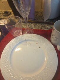 Dirty dishes in dishwasher. Looks like they have been sitting for some time.