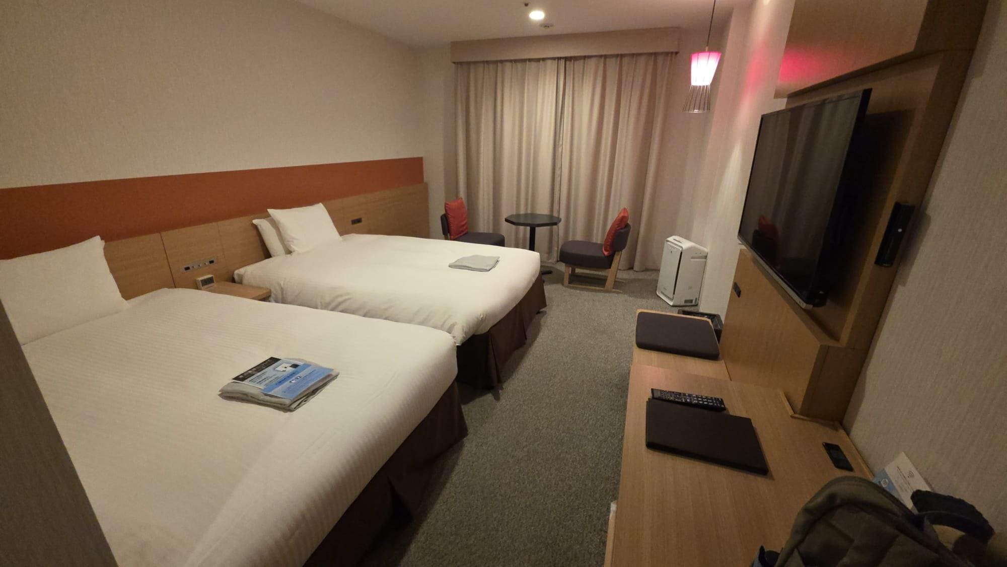 Big twin beds and plenty of space for luggage