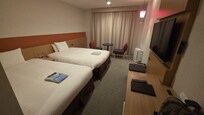 Big twin beds and plenty of space for luggage