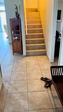 Entry, master bed right, half bath & garage left, stairs to bedrooms and bath upstairs