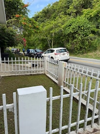Driveway is at the tail end of the white car, to the left. Sits on curve, BE CAREFUL pulling in/out!!